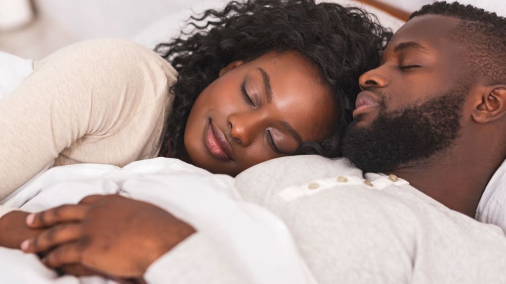 Sleeping Couple Embracing Each Other in Bed